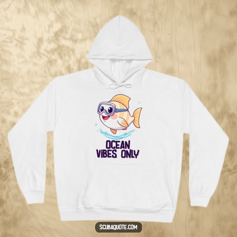 Funny hoodie depicting a smiling fish equipped with a diving mask, powerfully kicking its tail underwater with joy.