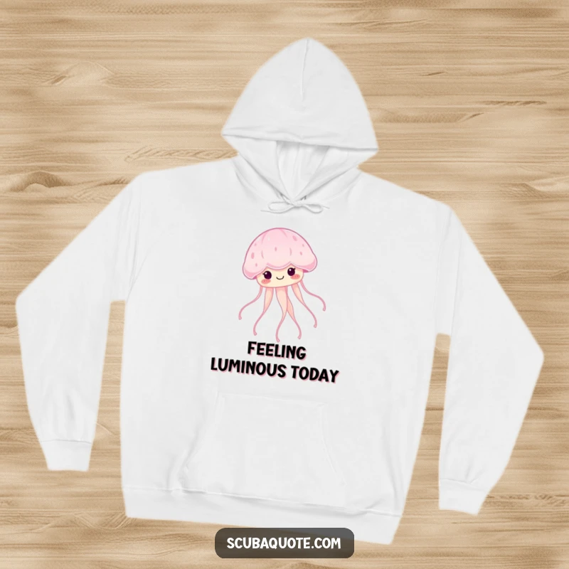 Funny smiling jellyfish floating serenely with glowing tendrils on a soft hoodie, perfect for serene vibes.