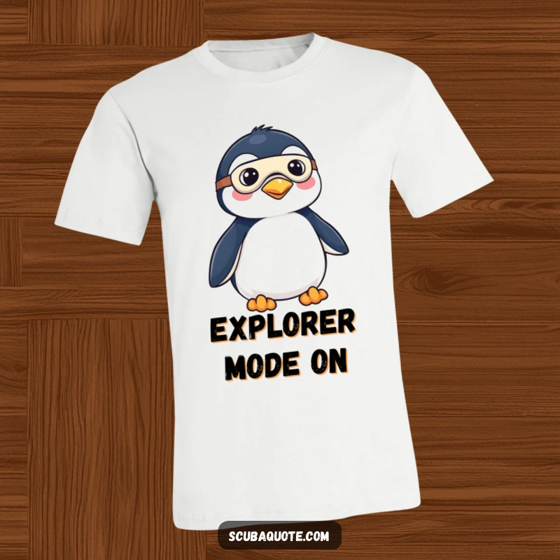 Funny T-shirt displaying a determined penguin in a mask and fins, ready to embark on thrilling aquatic adventures with a playful spirit.